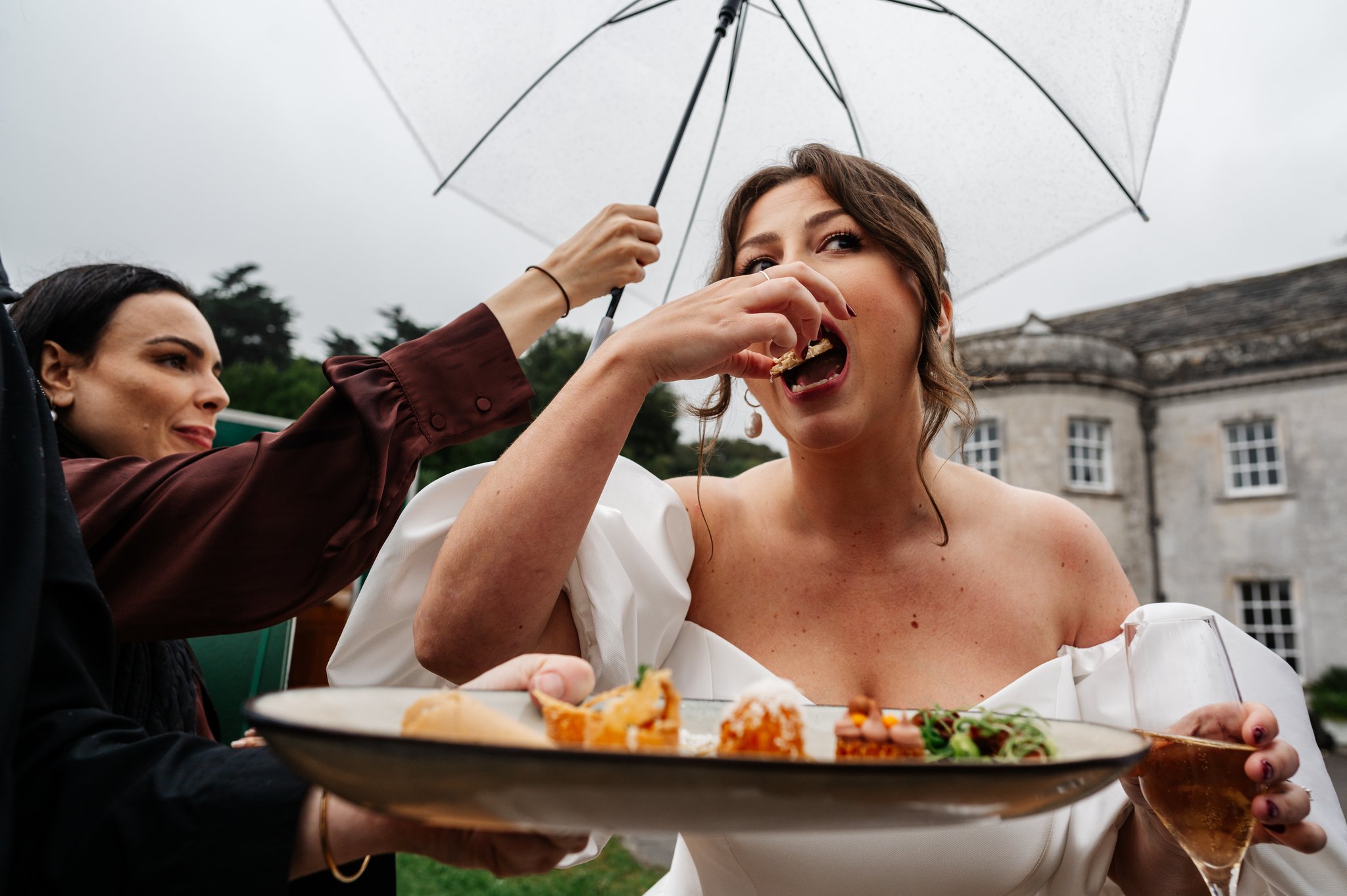 Bride eating a canape off a tray