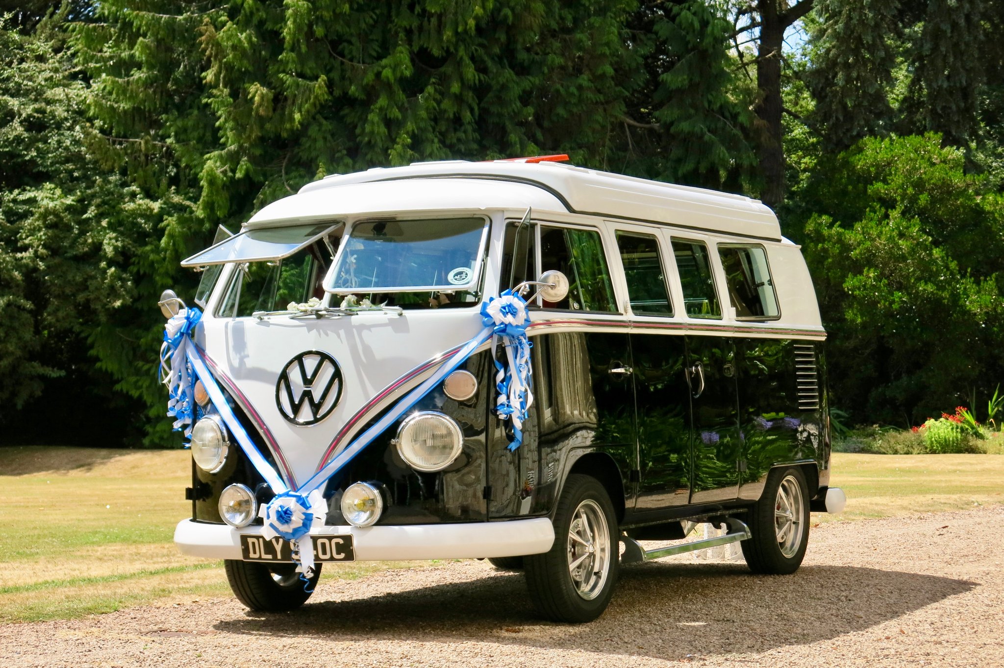 Black vintage VW camper van decorated for a wedding