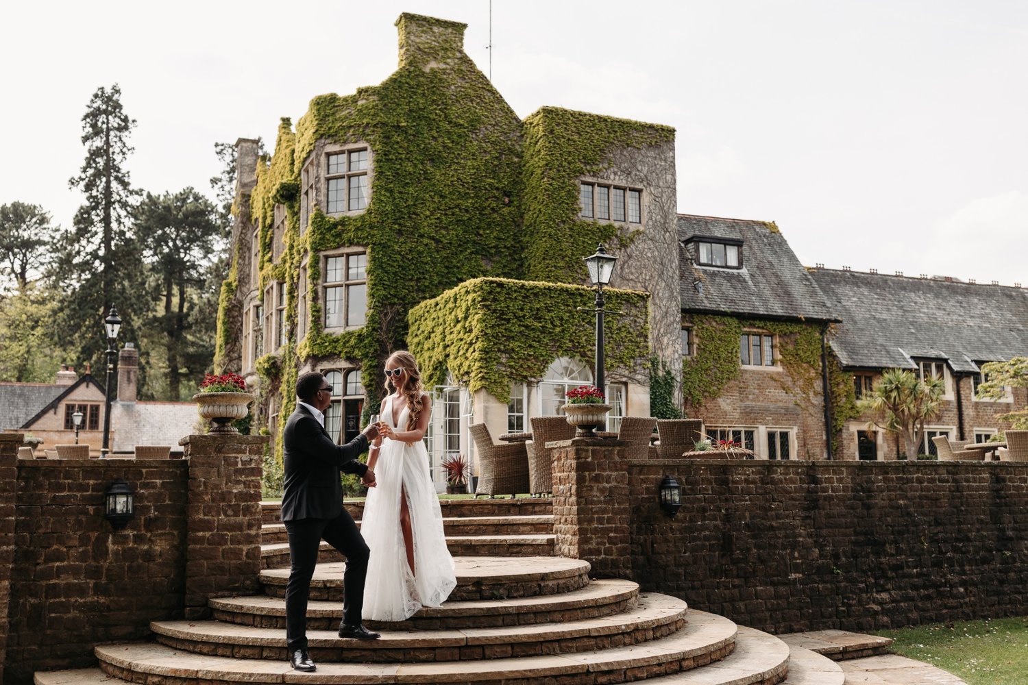 couple holding hands outside the wedding venue