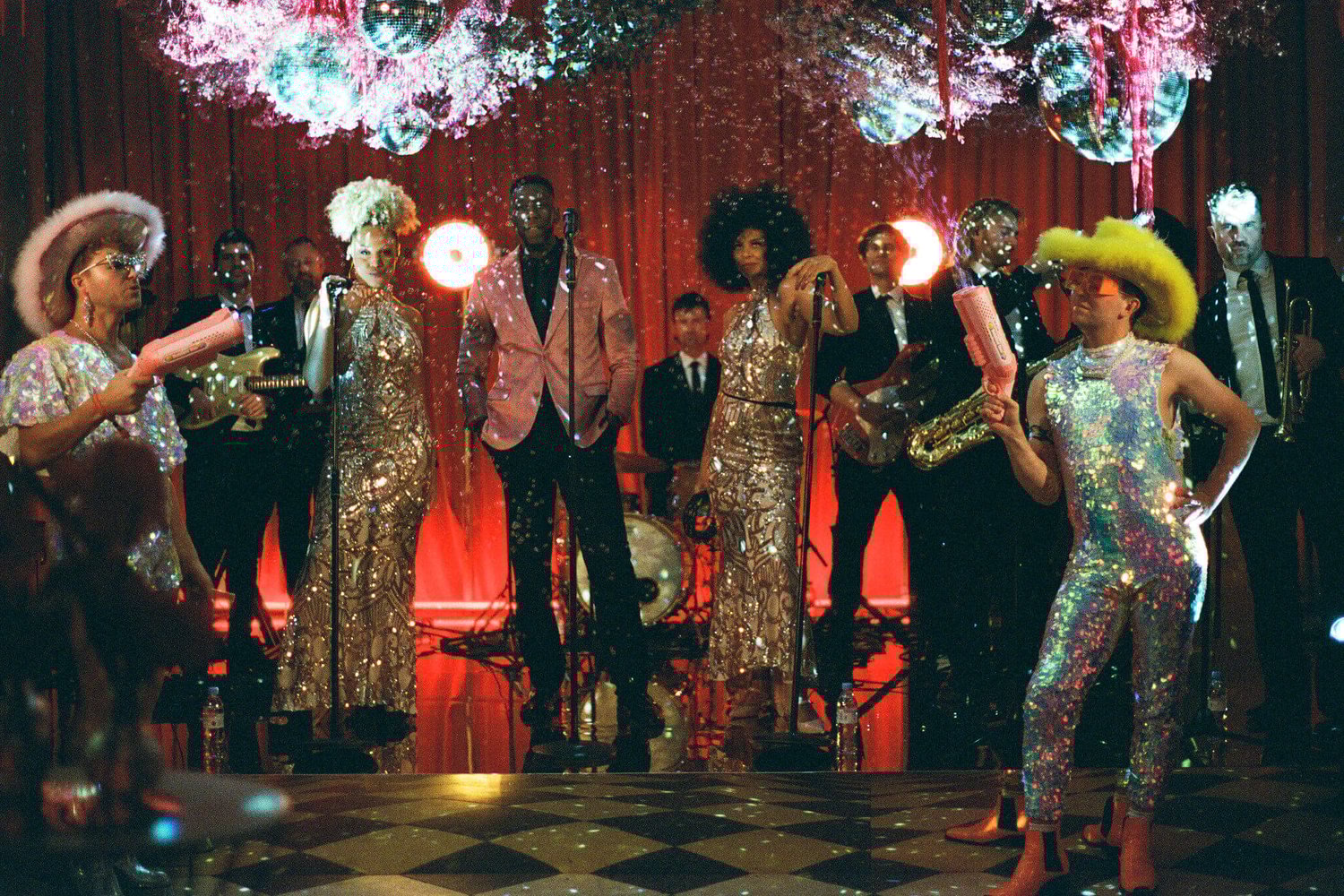 Live band wiuth discos from the ceiling and sequin outfits