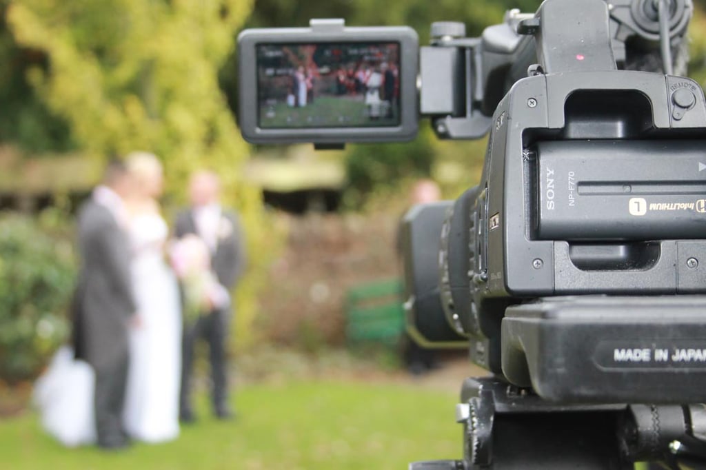 A video camera capturing wedding content